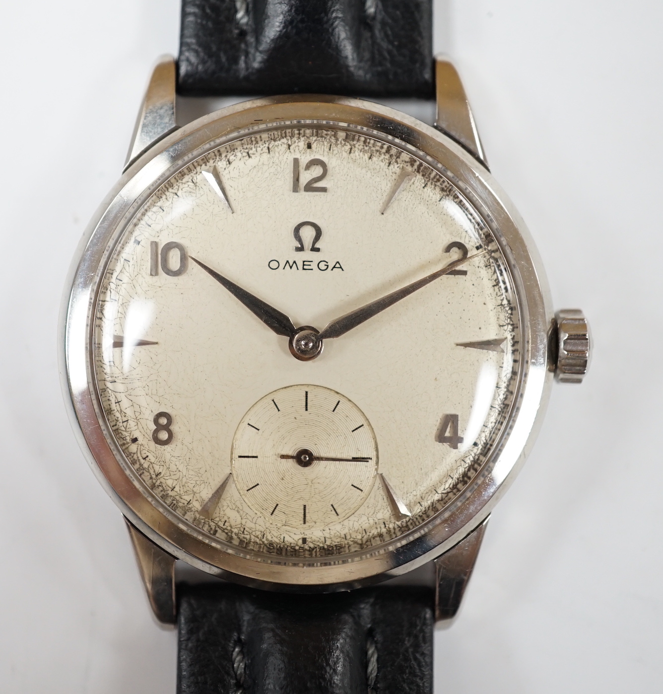 A gentleman's late 1950's stainless steel Omega manual wind wrist watch, with subsidiary seconds, on associated later leather strap, with Omega buckle, case diameter 35mm, no box or papers.